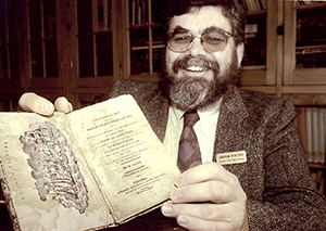 Andrew Porteus holding book